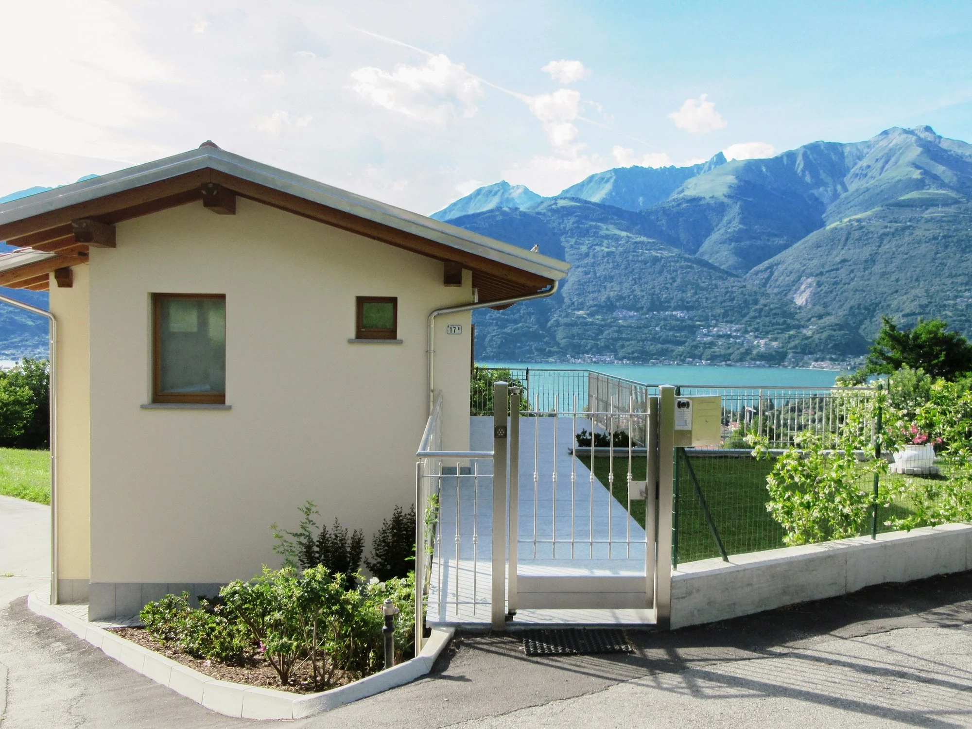 Lake Como seen from Villa Sweet Home, with mountains rising behind the water