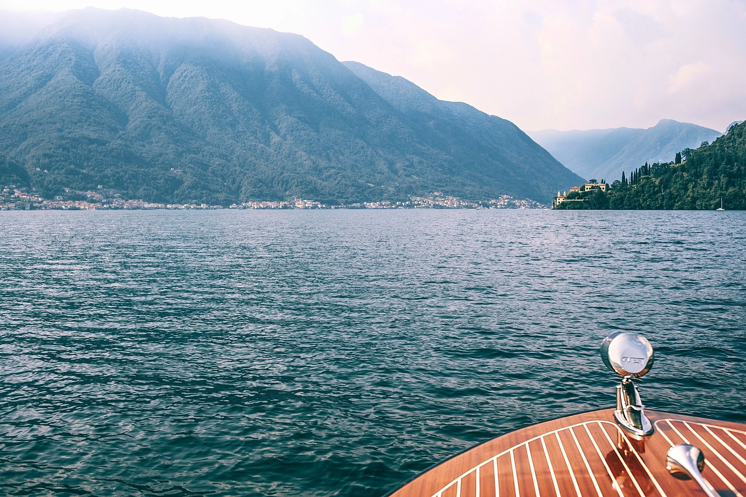 A boat on the calm waters of Lake Como